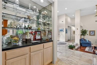 Spectacular location with stunning panoramic golf and water on Pipers Landing Country Club in Florida - for sale on GolfHomes.com, golf home, golf lot