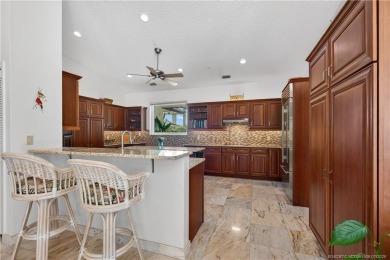 Spectacular location with stunning panoramic golf and water on Pipers Landing Country Club in Florida - for sale on GolfHomes.com, golf home, golf lot