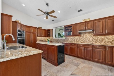 Spectacular location with stunning panoramic golf and water on Pipers Landing Country Club in Florida - for sale on GolfHomes.com, golf home, golf lot