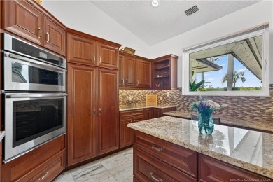 Spectacular location with stunning panoramic golf and water on Pipers Landing Country Club in Florida - for sale on GolfHomes.com, golf home, golf lot
