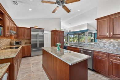 Spectacular location with stunning panoramic golf and water on Pipers Landing Country Club in Florida - for sale on GolfHomes.com, golf home, golf lot