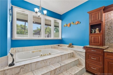 Spectacular location with stunning panoramic golf and water on Pipers Landing Country Club in Florida - for sale on GolfHomes.com, golf home, golf lot