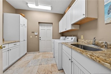 Spectacular location with stunning panoramic golf and water on Pipers Landing Country Club in Florida - for sale on GolfHomes.com, golf home, golf lot