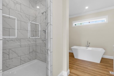 Why settle for ordinary when you can own this 2025 custom-built on Minnesott Golf and Country Club in North Carolina - for sale on GolfHomes.com, golf home, golf lot