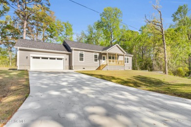 Why settle for ordinary when you can own this 2025 custom-built on Minnesott Golf and Country Club in North Carolina - for sale on GolfHomes.com, golf home, golf lot