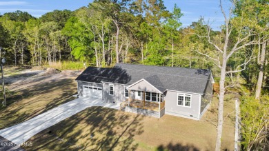 Why settle for ordinary when you can own this 2025 custom-built on Minnesott Golf and Country Club in North Carolina - for sale on GolfHomes.com, golf home, golf lot