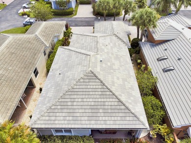 Nestled within Oxford Estates, a charming gated enclave in posh on Boca Lago Golf and Country Club in Florida - for sale on GolfHomes.com, golf home, golf lot