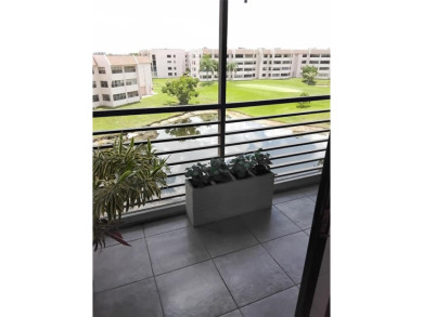 Nicely upgraded, top floor, fully tiled condo with screened on Sunrise Lakes Phase IV Golf Course in Florida - for sale on GolfHomes.com, golf home, golf lot