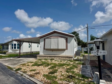 This updated 1985 single-wide mobile home offers just over 800 on Heather Hills Golf Course in Florida - for sale on GolfHomes.com, golf home, golf lot