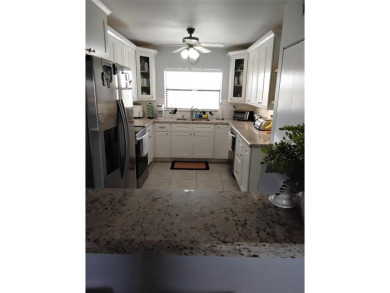 Nicely upgraded, top floor, fully tiled condo with screened on Sunrise Lakes Phase IV Golf Course in Florida - for sale on GolfHomes.com, golf home, golf lot