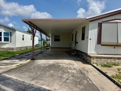 This updated 1985 single-wide mobile home offers just over 800 on Heather Hills Golf Course in Florida - for sale on GolfHomes.com, golf home, golf lot