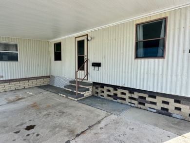 This updated 1985 single-wide mobile home offers just over 800 on Heather Hills Golf Course in Florida - for sale on GolfHomes.com, golf home, golf lot
