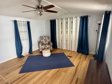 This updated 1985 single-wide mobile home offers just over 800 on Heather Hills Golf Course in Florida - for sale on GolfHomes.com, golf home, golf lot