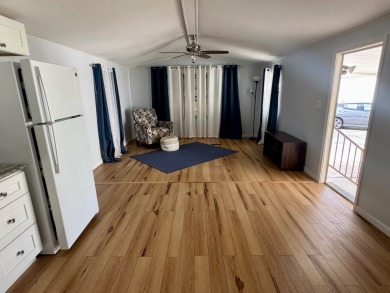 This updated 1985 single-wide mobile home offers just over 800 on Heather Hills Golf Course in Florida - for sale on GolfHomes.com, golf home, golf lot