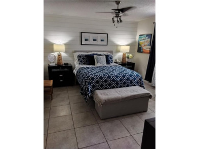 Nicely upgraded, top floor, fully tiled condo with screened on Sunrise Lakes Phase IV Golf Course in Florida - for sale on GolfHomes.com, golf home, golf lot