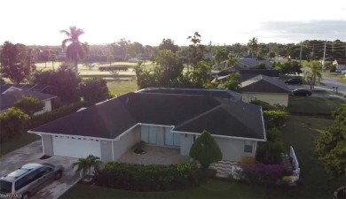 Spacious San Carlos home with pool & jacuzzi on a prime corner on Estero Country Club in Florida - for sale on GolfHomes.com, golf home, golf lot