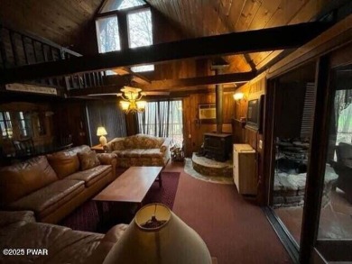 Tanglwood Lakes sprawling home situated on a level wooded lot on Paupack Hills Golf and Country Club in Pennsylvania - for sale on GolfHomes.com, golf home, golf lot