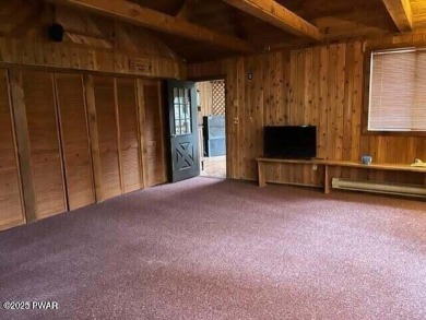 Tanglwood Lakes sprawling home situated on a level wooded lot on Paupack Hills Golf and Country Club in Pennsylvania - for sale on GolfHomes.com, golf home, golf lot