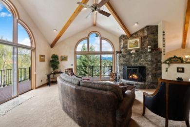 If you want beautiful Swan Mountain views from almost every room on Eagle Bend Golf Course in Montana - for sale on GolfHomes.com, golf home, golf lot