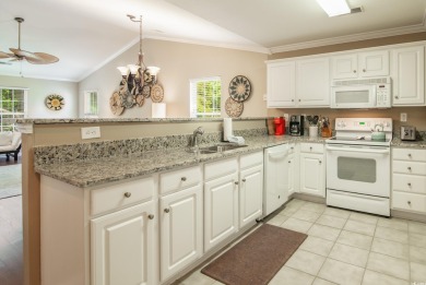 Welcome to coastal living at its finest! Updated kitchen granite on True Blue Plantation in South Carolina - for sale on GolfHomes.com, golf home, golf lot