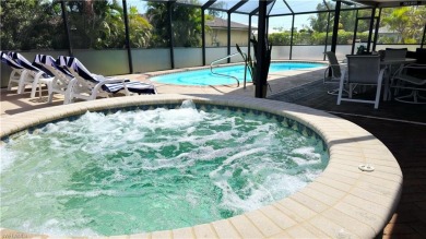 Spacious San Carlos home with pool & jacuzzi on a prime corner on Estero Country Club in Florida - for sale on GolfHomes.com, golf home, golf lot