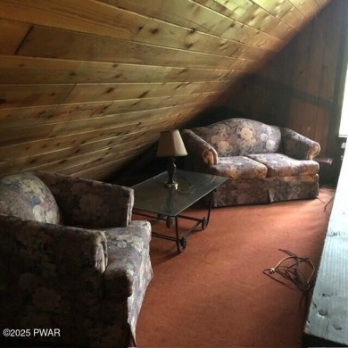 Tanglwood Lakes sprawling home situated on a level wooded lot on Paupack Hills Golf and Country Club in Pennsylvania - for sale on GolfHomes.com, golf home, golf lot