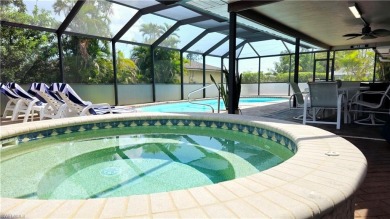 Spacious San Carlos home with pool & jacuzzi on a prime corner on Estero Country Club in Florida - for sale on GolfHomes.com, golf home, golf lot