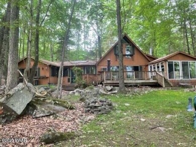 Tanglwood Lakes sprawling home situated on a level wooded lot on Paupack Hills Golf and Country Club in Pennsylvania - for sale on GolfHomes.com, golf home, golf lot