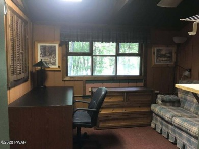 Tanglwood Lakes sprawling home situated on a level wooded lot on Paupack Hills Golf and Country Club in Pennsylvania - for sale on GolfHomes.com, golf home, golf lot