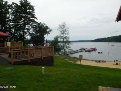Tanglwood Lakes sprawling home situated on a level wooded lot on Paupack Hills Golf and Country Club in Pennsylvania - for sale on GolfHomes.com, golf home, golf lot