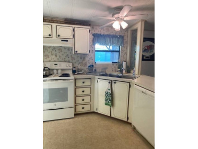 TIRED OF SNOW,ICE AND COLD, TRADE IT IN FOR SUN,WARM AND WHITE on Pine Lakes Country Club in Florida - for sale on GolfHomes.com, golf home, golf lot
