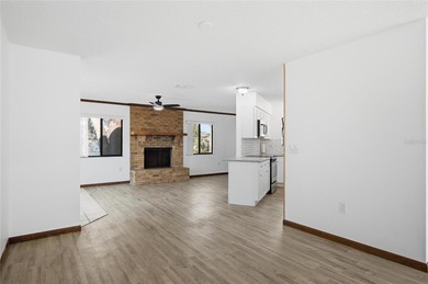 Welcome home to this beautifully updated 2-bedroom, 2-bath gem on The Grand Club - Pine Lakes Course in Florida - for sale on GolfHomes.com, golf home, golf lot