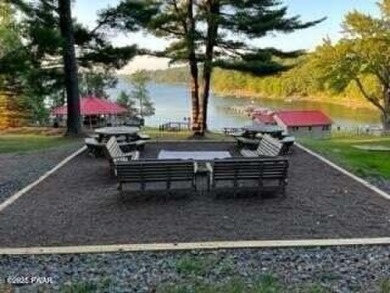 Tanglwood Lakes sprawling home situated on a level wooded lot on Paupack Hills Golf and Country Club in Pennsylvania - for sale on GolfHomes.com, golf home, golf lot