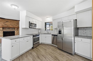 Welcome home to this beautifully updated 2-bedroom, 2-bath gem on The Grand Club - Pine Lakes Course in Florida - for sale on GolfHomes.com, golf home, golf lot