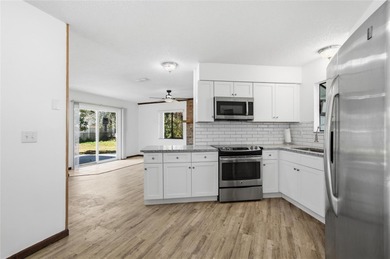 Welcome home to this beautifully updated 2-bedroom, 2-bath gem on The Grand Club - Pine Lakes Course in Florida - for sale on GolfHomes.com, golf home, golf lot