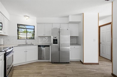 Welcome home to this beautifully updated 2-bedroom, 2-bath gem on The Grand Club - Pine Lakes Course in Florida - for sale on GolfHomes.com, golf home, golf lot