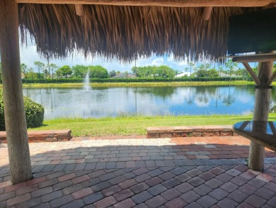 Well appointed back in lot with Tiki on the natural pond.  Soak on St. Lucie Trail Golf Club in Florida - for sale on GolfHomes.com, golf home, golf lot