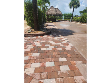 Well appointed back in lot with Tiki on the natural pond.  Soak on St. Lucie Trail Golf Club in Florida - for sale on GolfHomes.com, golf home, golf lot