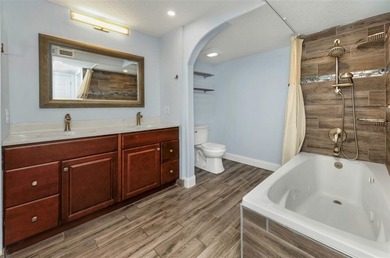 Move right into this beautifully updated first-floor condo on East Lake Woodlands Country Club in Florida - for sale on GolfHomes.com, golf home, golf lot