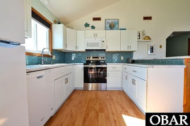 Sitting well elevated in an X flood zone, Sunny Days is located on The Currituck Golf Club in North Carolina - for sale on GolfHomes.com, golf home, golf lot