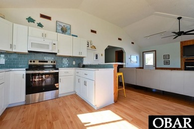 Sitting well elevated in an X flood zone, Sunny Days is located on The Currituck Golf Club in North Carolina - for sale on GolfHomes.com, golf home, golf lot