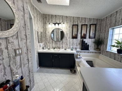 Welcome to this beautifully remodeled 3-bedroom, 2-bathroom home on Four Lakes Golf Club in Florida - for sale on GolfHomes.com, golf home, golf lot