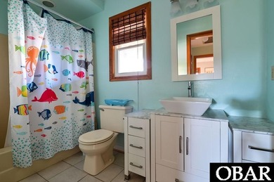 Sitting well elevated in an X flood zone, Sunny Days is located on The Currituck Golf Club in North Carolina - for sale on GolfHomes.com, golf home, golf lot