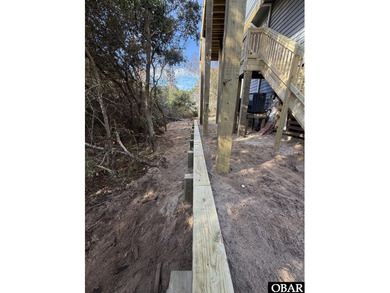 Sitting well elevated in an X flood zone, Sunny Days is located on The Currituck Golf Club in North Carolina - for sale on GolfHomes.com, golf home, golf lot