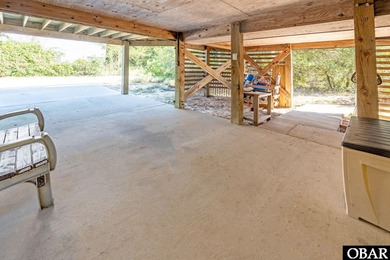 Sitting well elevated in an X flood zone, Sunny Days is located on The Currituck Golf Club in North Carolina - for sale on GolfHomes.com, golf home, golf lot