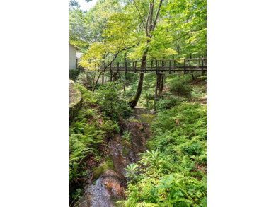 Welcome to the Bridge House -- Your Private Mountain Escape on Sapphire National Golf Club in North Carolina - for sale on GolfHomes.com, golf home, golf lot