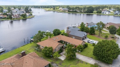This Mediterranean-style brick home offers panoramic views of on Harbour Point Golf Club in North Carolina - for sale on GolfHomes.com, golf home, golf lot