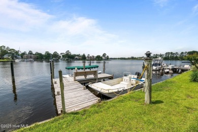 This Mediterranean-style brick home offers panoramic views of on Harbour Point Golf Club in North Carolina - for sale on GolfHomes.com, golf home, golf lot