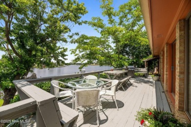 This Mediterranean-style brick home offers panoramic views of on Harbour Point Golf Club in North Carolina - for sale on GolfHomes.com, golf home, golf lot