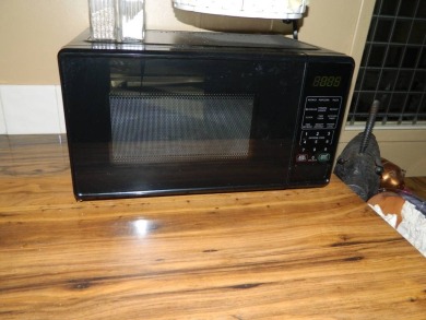 1985 Ventura 26x48 has been updated with double pane windows on Grasslands Golf and Country Club in Florida - for sale on GolfHomes.com, golf home, golf lot